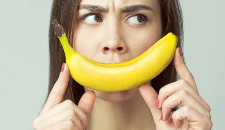 girl with banana mimics penis enlargement massage